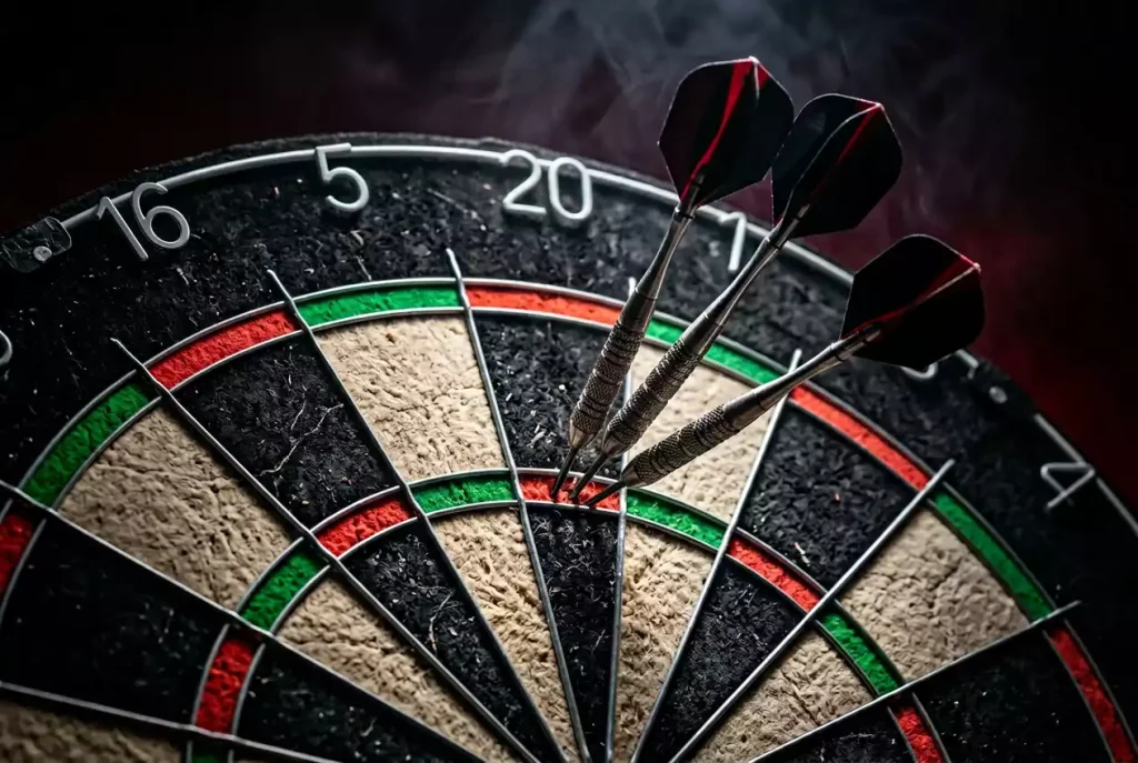 180er-Wetten bei Darts – drei Darts im Triple-20-Segment der Dartscheibe
